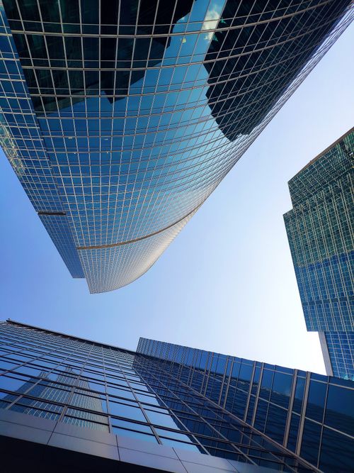 Free Modern glass skyscrapers reaching towards the sky in Moscow's financial hub. Stock Photo