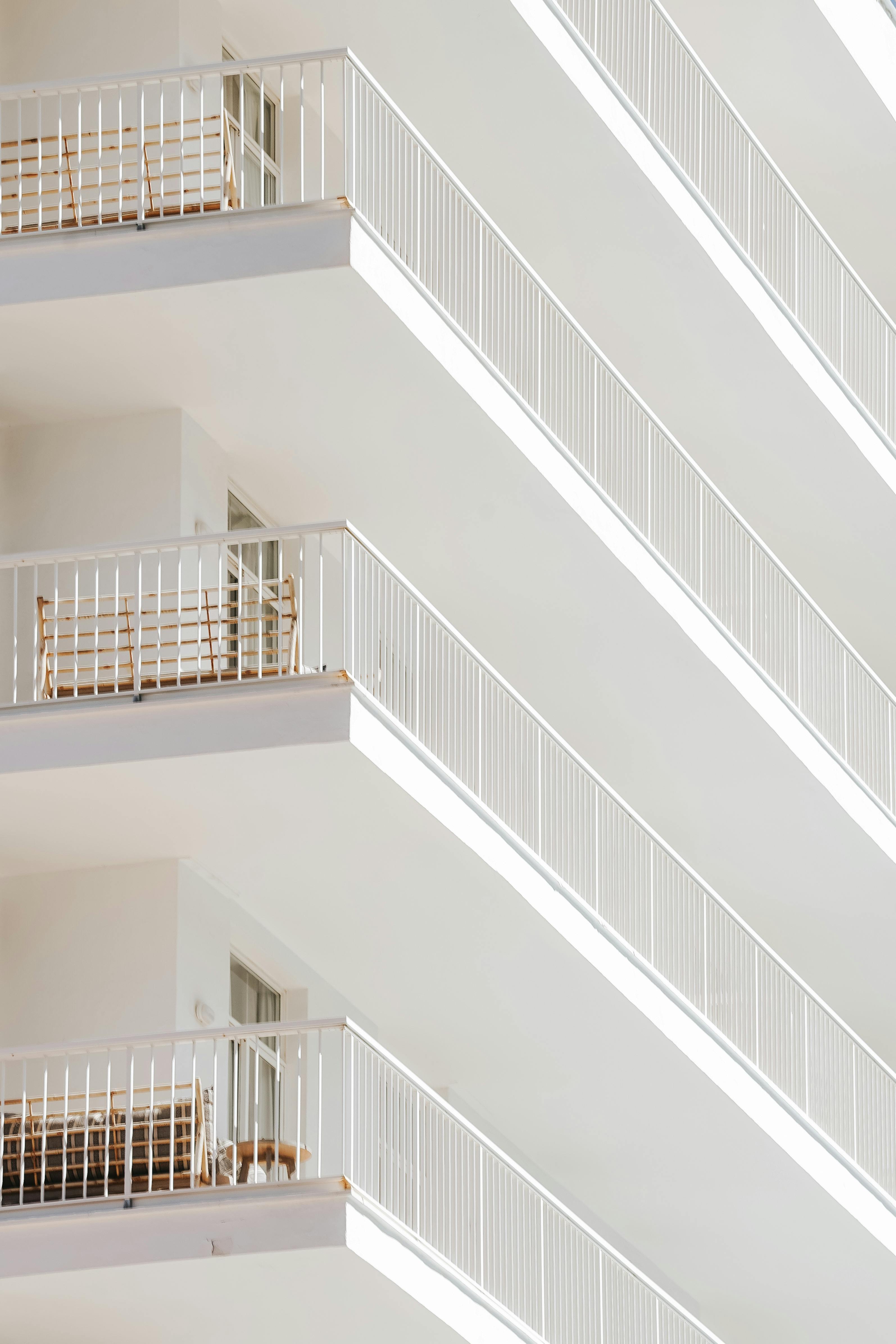 Abstract view of elegant white balconies showcasing modern minimalist architecture.
