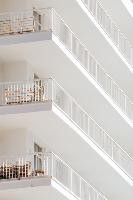 Abstract view of elegant white balconies showcasing modern minimalist architecture.