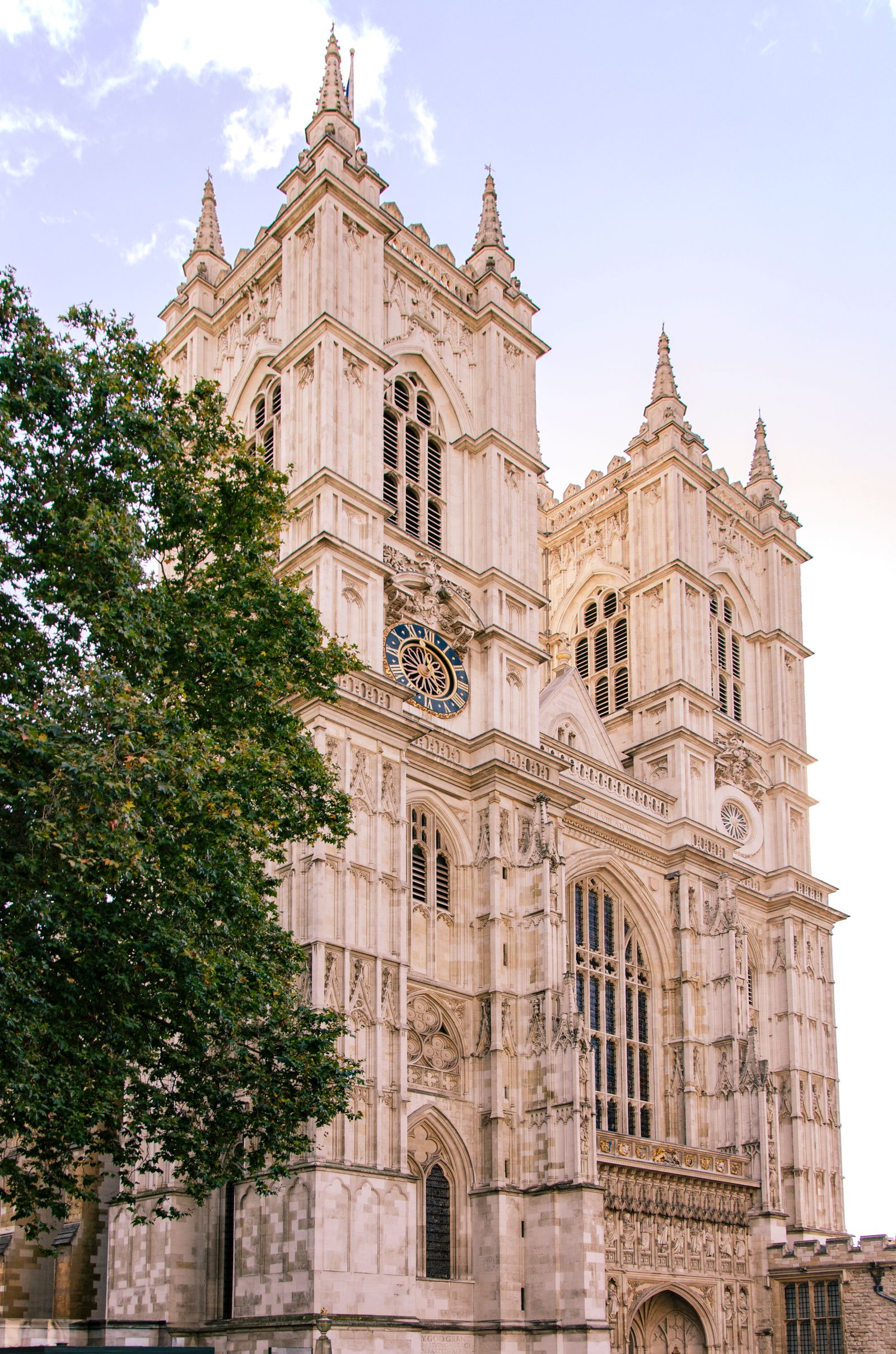 Westminster Abbey's twin Gothic towers rising against a clear London sky
