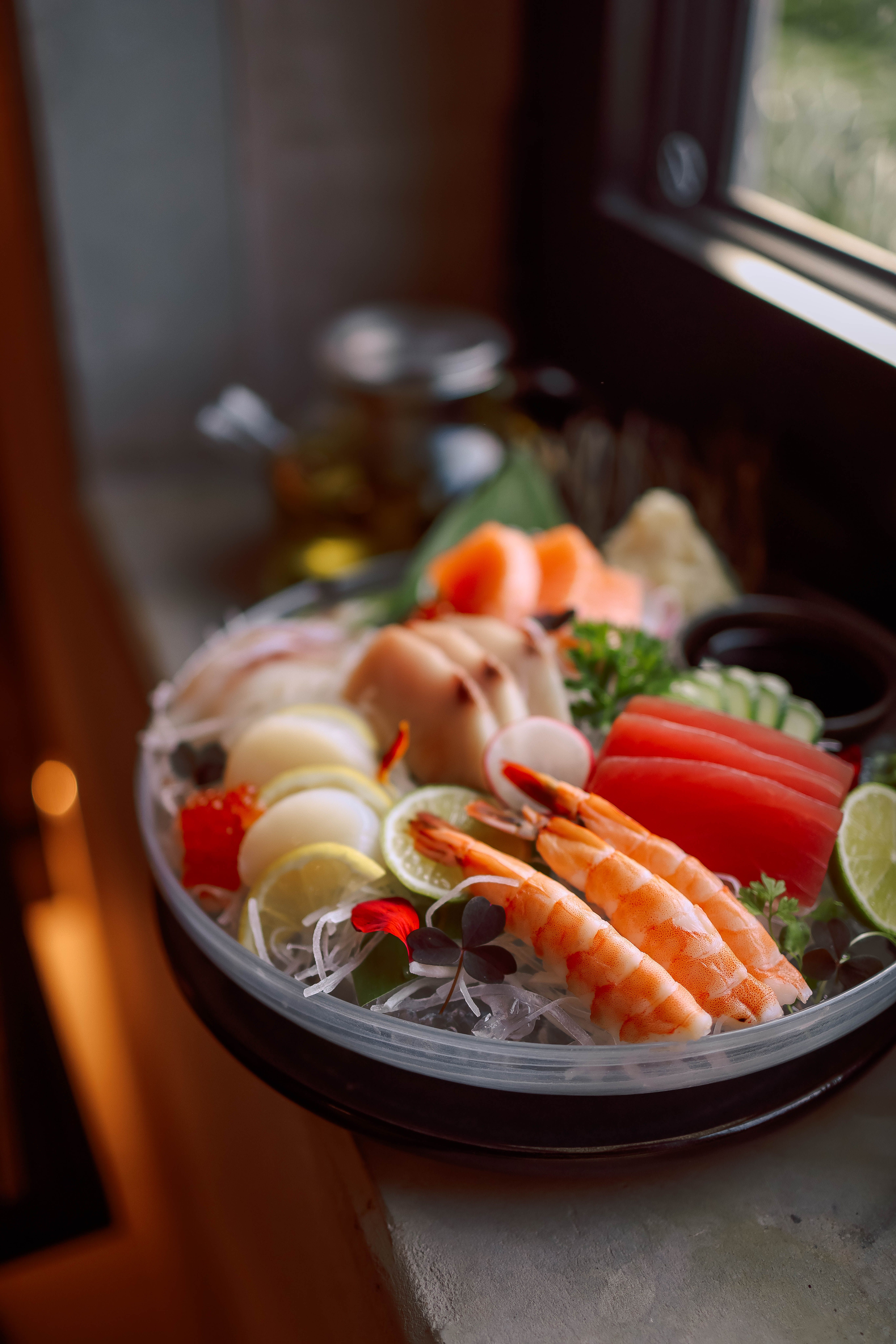 Vibrant sushi platter featuring fresh seafood and vegetables in natural light.