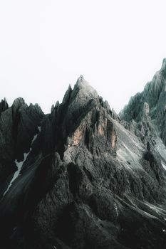 Stunning day view of the jagged Dolomites mountain peaks with snow patches. 28701196