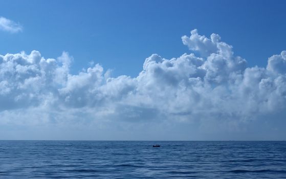 Serene ocean horizon with dramatic cloud formations in Puduchery, India.