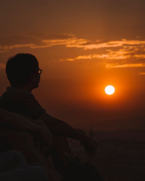 Free A tranquil silhouette of a person at sunset in Ankara, capturing a peaceful and reflective moment. Stock Photo