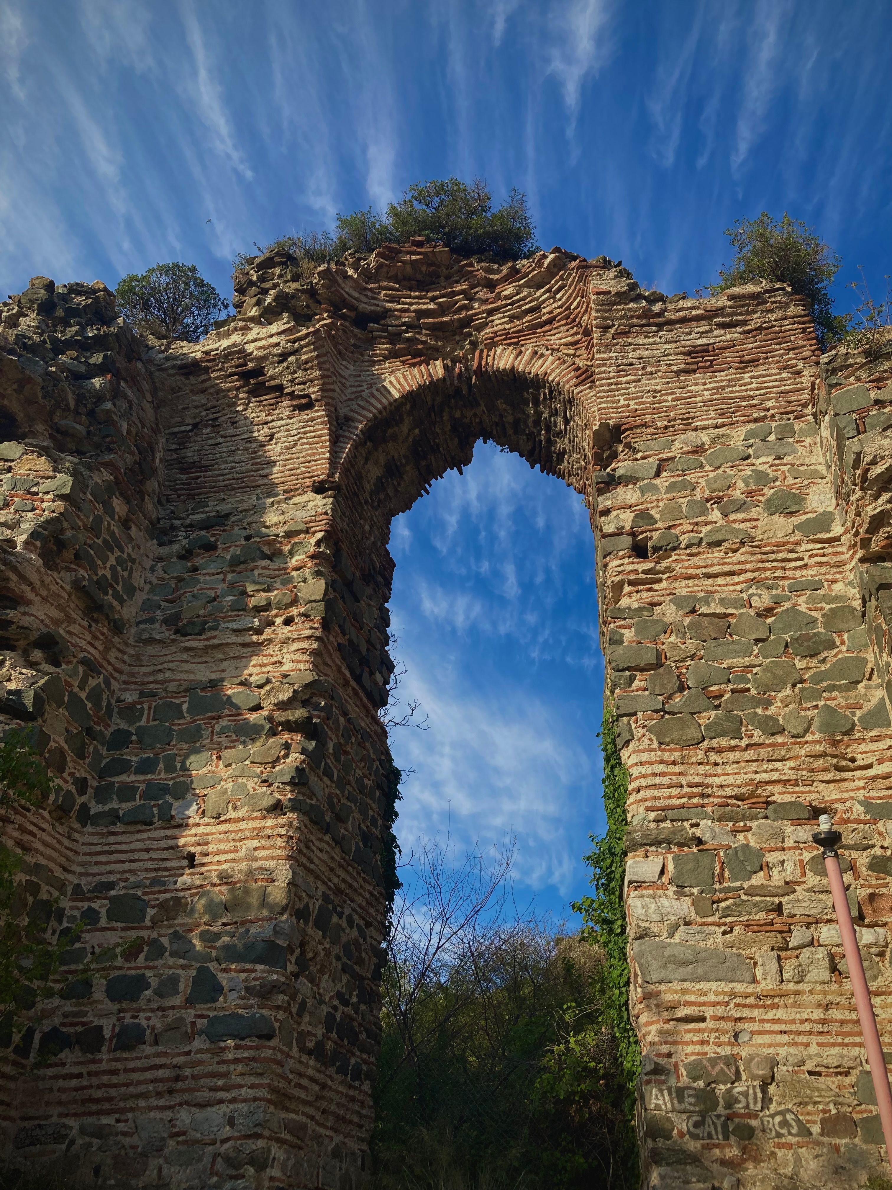 Ancient Roman Ruins Against Clear Blue Sky · Free Stock Photo