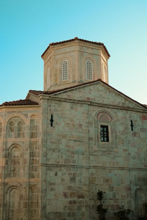 Free Beautiful stone church with intricate design under a clear blue sky, showcasing historical architecture. Stock Photo