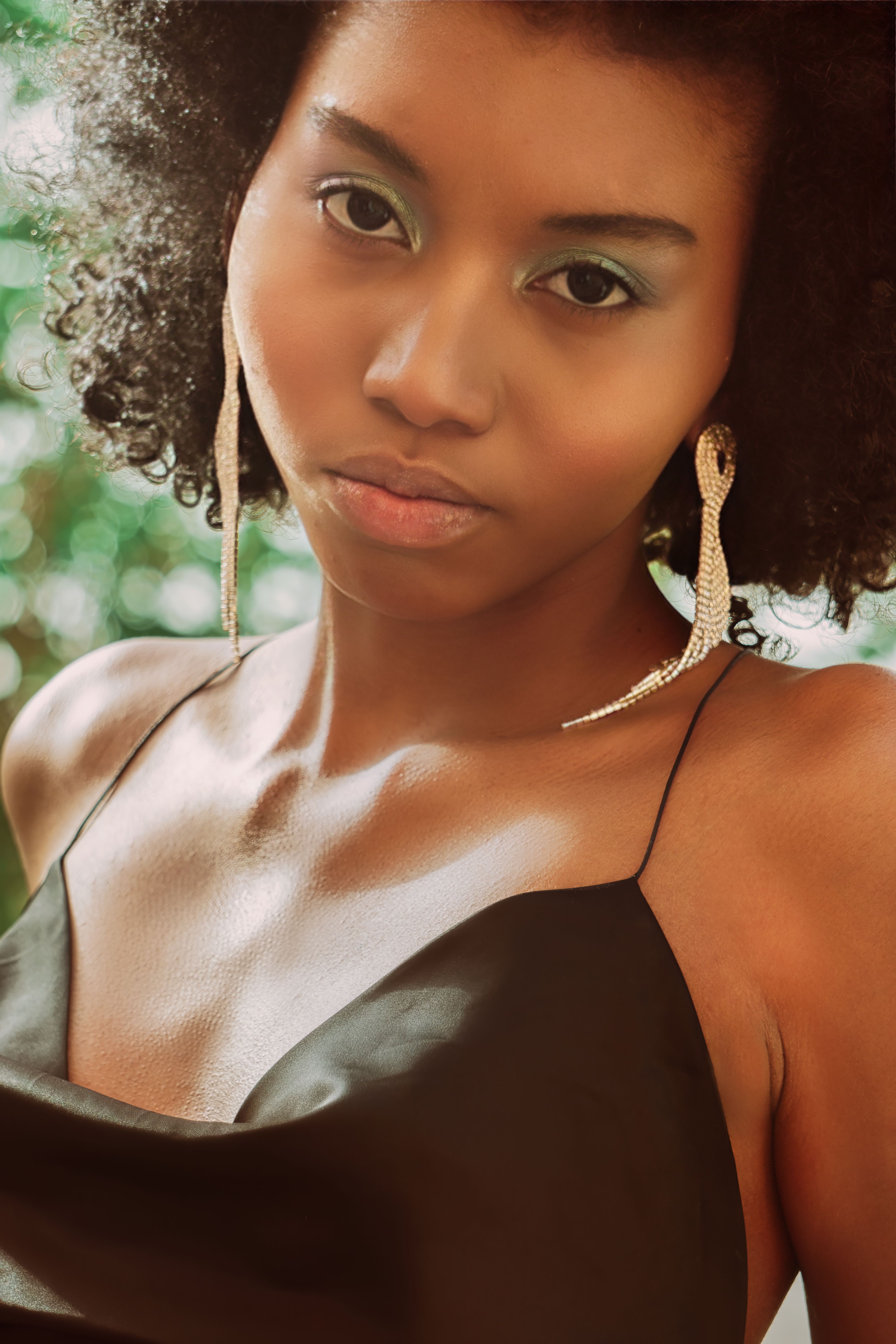 Elegant Portrait of Woman with Curly Hair · Free Stock Photo