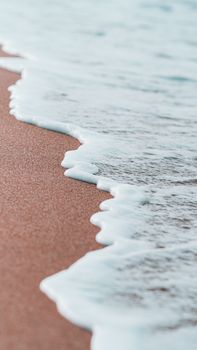 Experience the serene beauty of waves gently washing over sandy shores of Tabarka, Tunisia.
