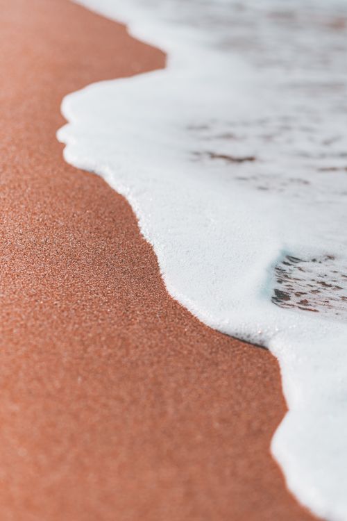 Free Peaceful beach scene with gentle waves on the Tabarka, Tunisia coast. Stock Photo