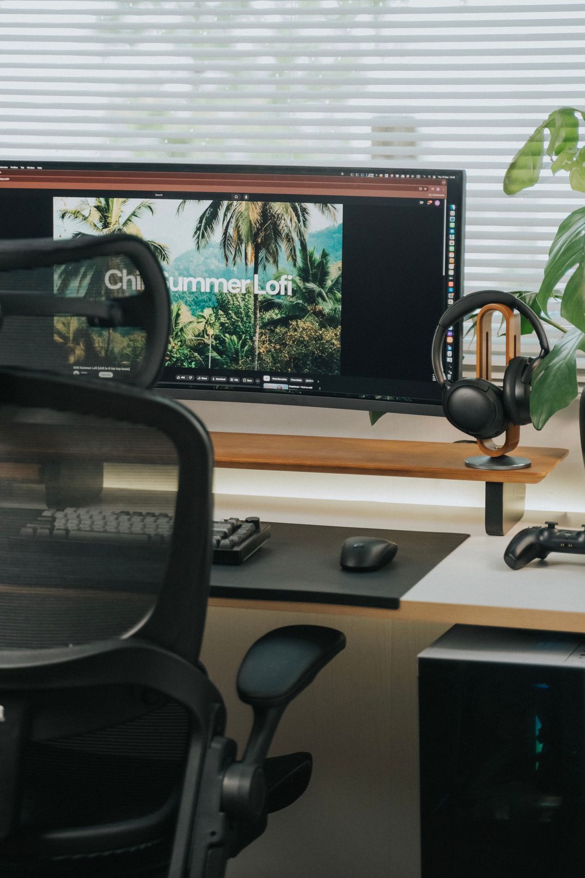 Modern home office desk with ergonomic chair, monitor and workspace accessories