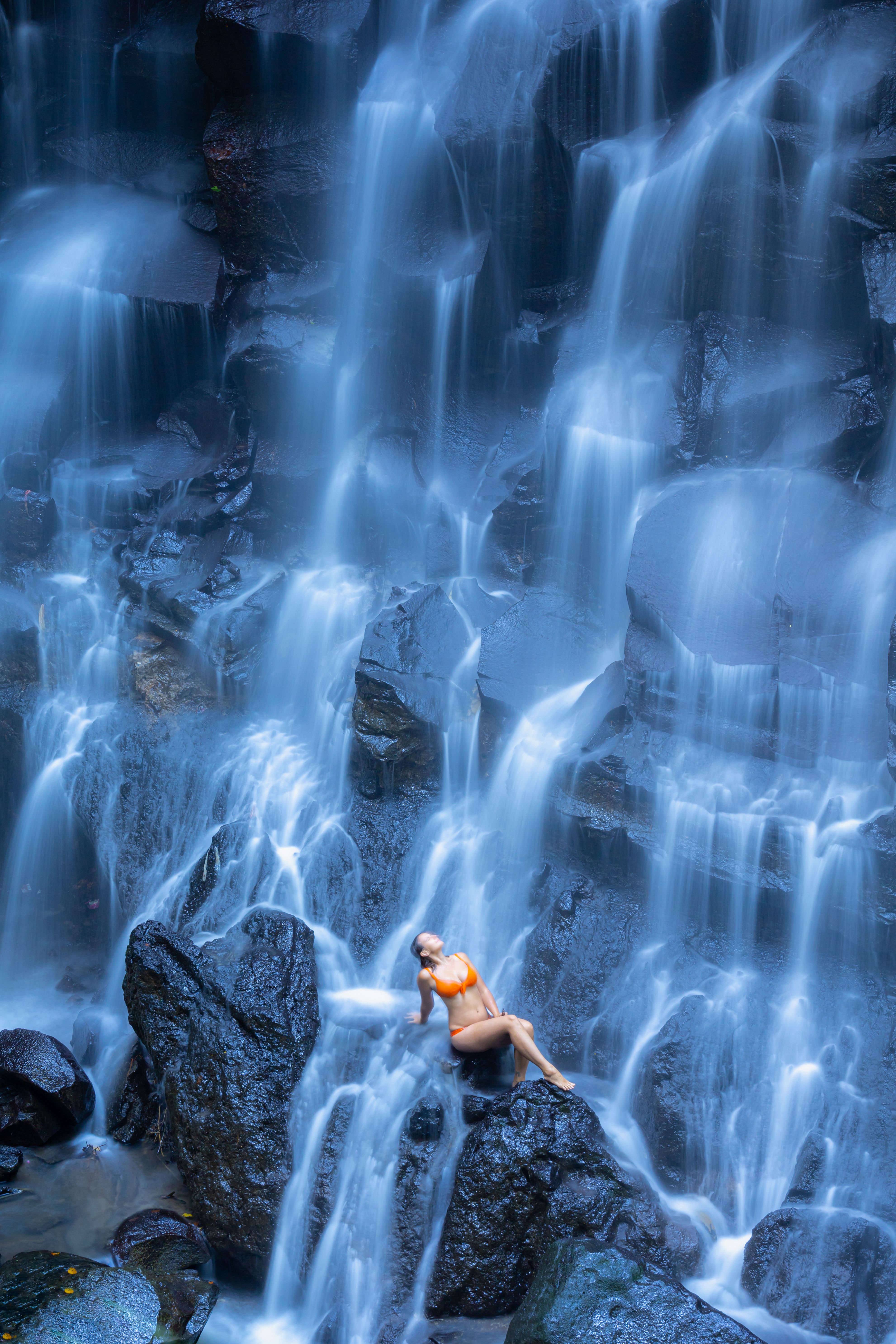 Woman Posing by Stunning Waterfall · Free Stock Photo