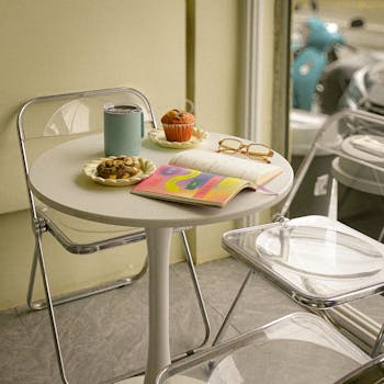 Inviting coffee shop setup with snacks, journal, and cozy atmosphere. Perfect for relaxation.