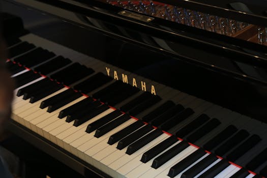 Detailed view of a Yamaha piano keyboard, showcasing its elegant design.