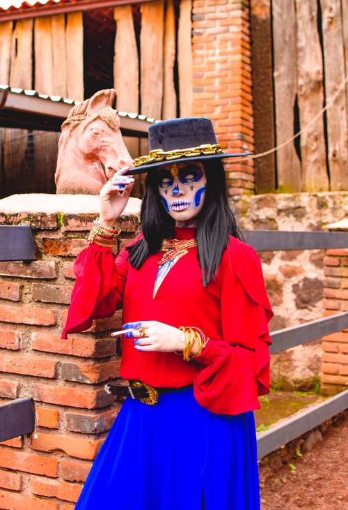 Free Traditional Catrina costume with vibrant makeup and attire in San Bartolomé Xicomulco, CDMX during Day of the Dead celebration. Stock Photo