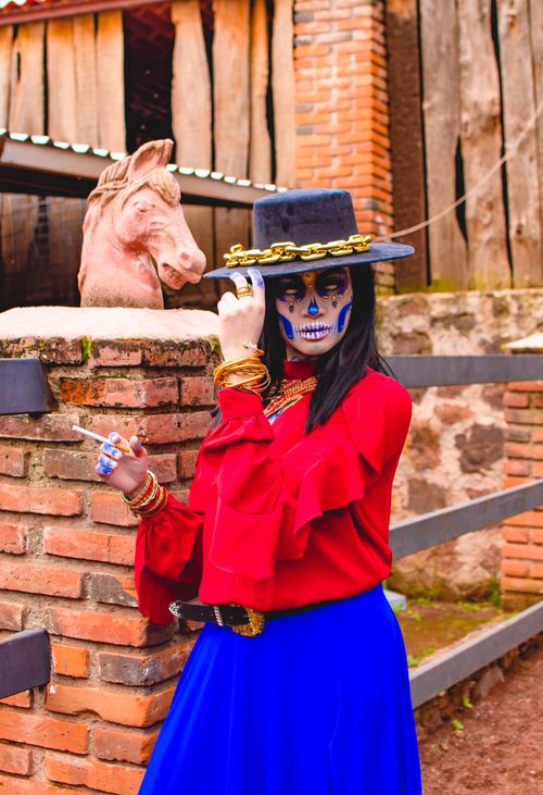 Free Colorful Day of the Dead Catrina in vibrant clothing, San Bartolomé Xicomulco, Mexico. Stock Photo