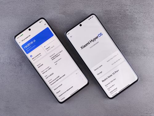 Free Comparison of two smartphones showing Realme UI and Xiaomi HyperOS interfaces on their screens. Stock Photo