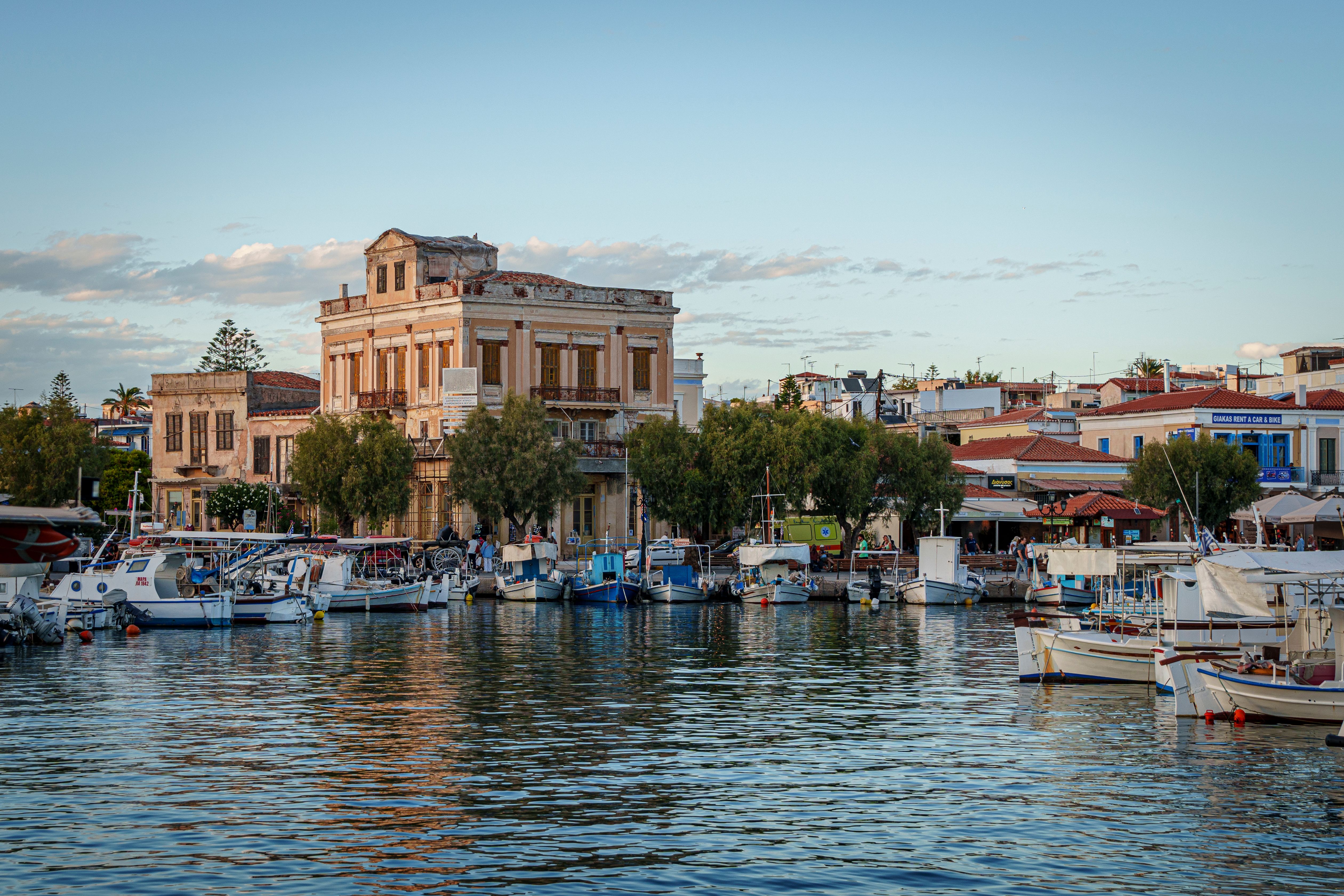 Aegina island day trip from Athens - beautiful marina with boats and historic architecture