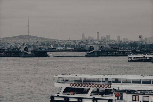 Free Bosphorus view from Istanbul with Galata Bridge and city skyline on a cloudy day. Stock Photo