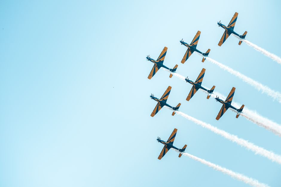 Stunning aerial performance by synchronized planes in a clear blue sky in Brazil.