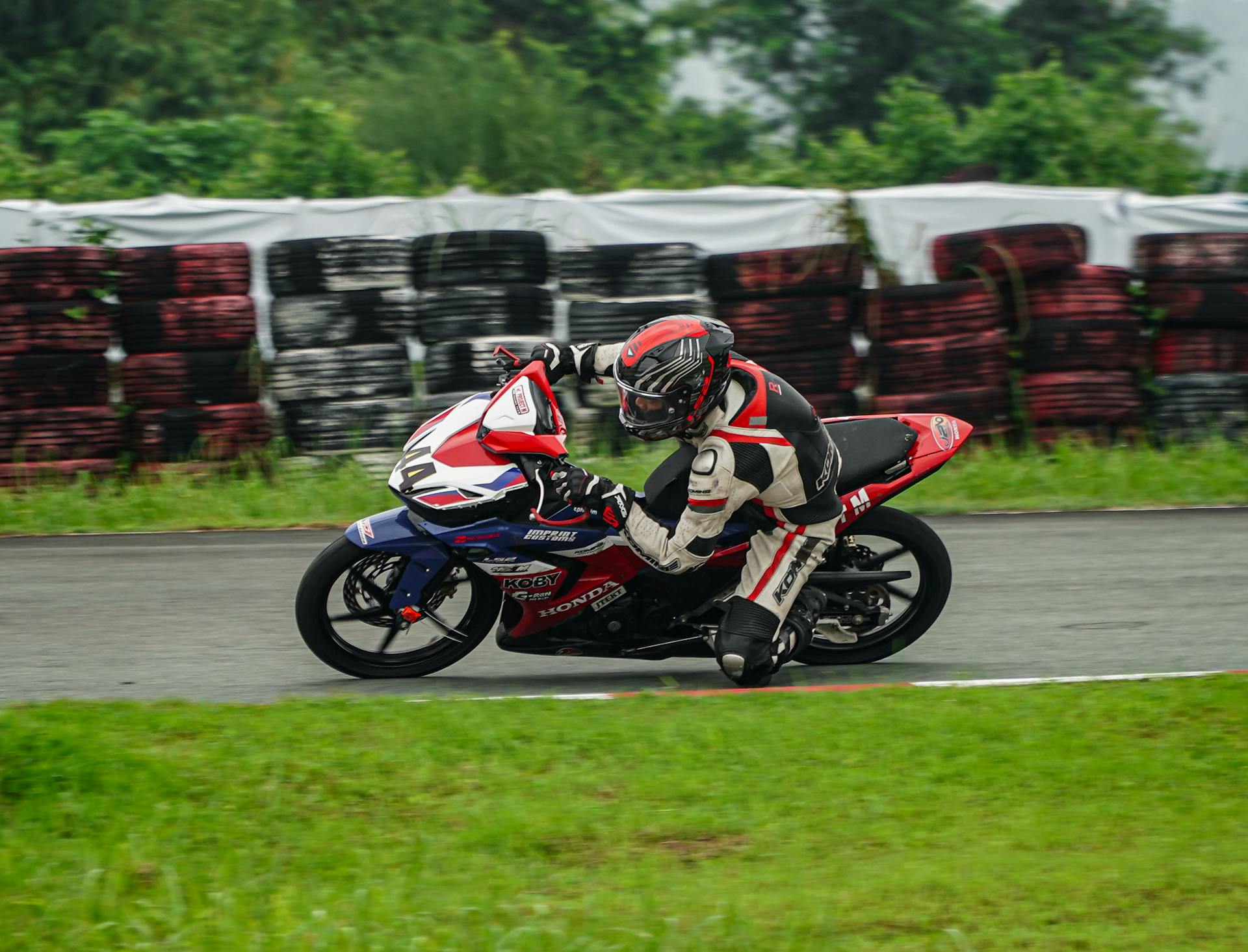 Motorcycle Racer Leaning into Turn at Tarlac Circuit