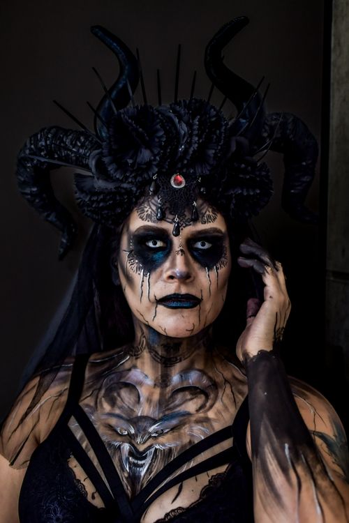 Dark Fantasy Portrait of Woman with Horns and Face Paint · Free Stock Photo