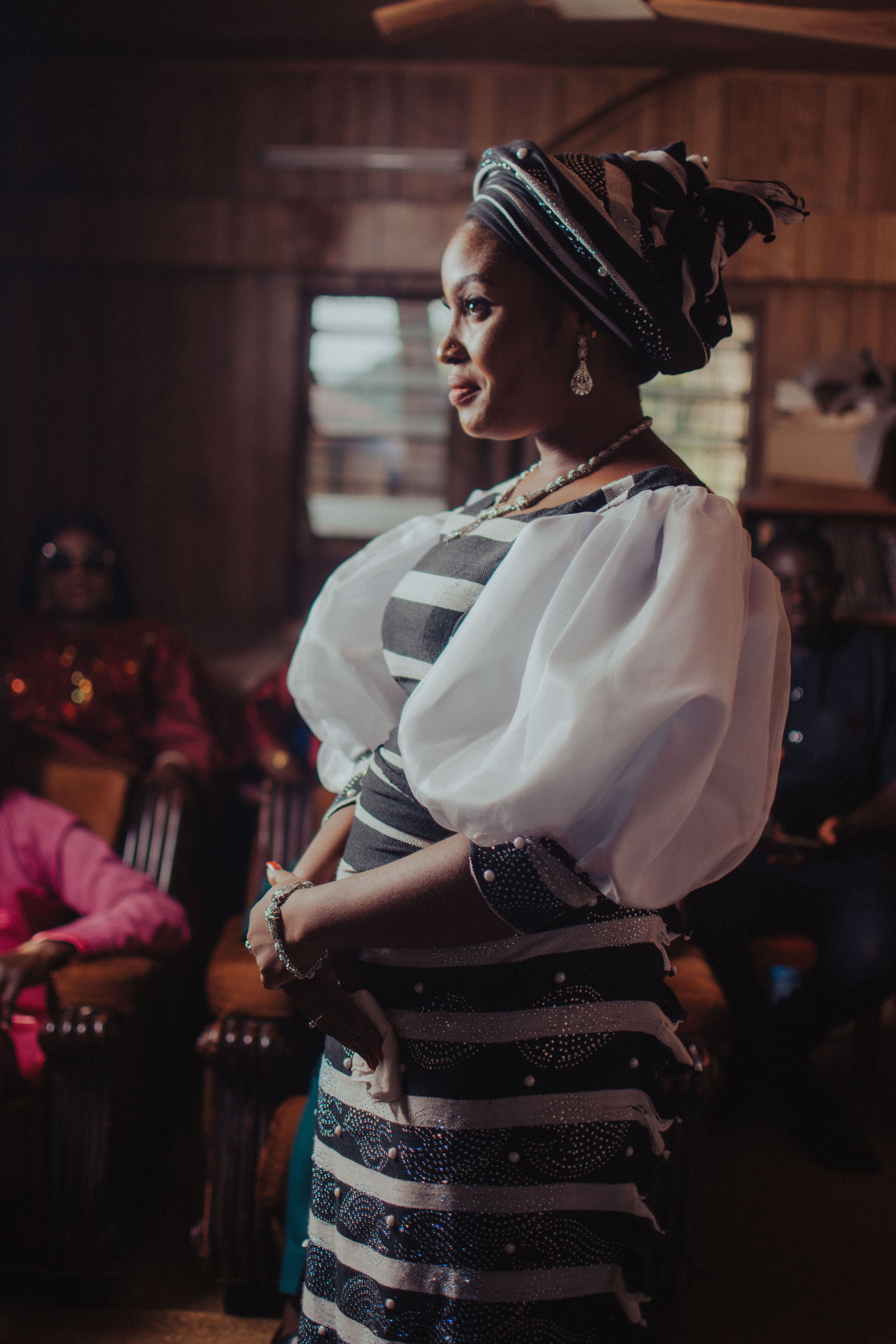 Elegant Woman in Traditional African Attire Indoors · Free Stock Photo