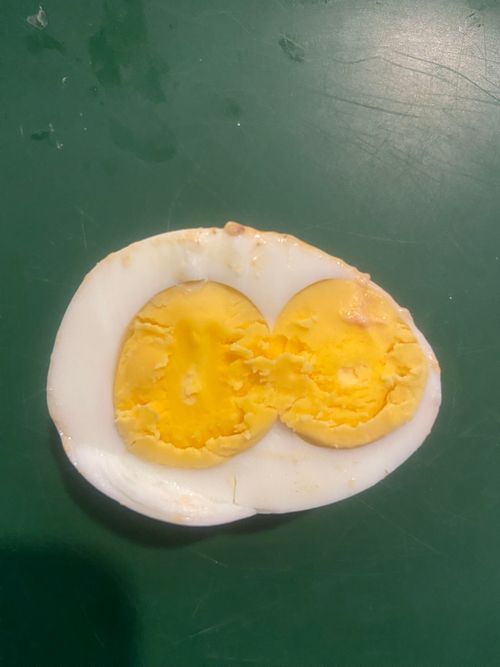 Free  “Double Yolk Surprise: A Rare Culinary Delight”  Description: Discover the rare and fascinating phenomenon of two yolks in a single boiled egg. This unique occurrence is not only a treat ... Stock Photo