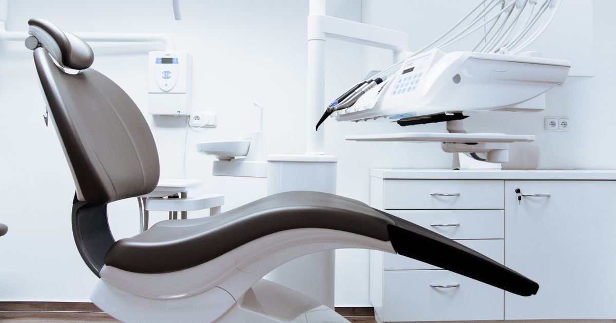 Modern clinic interior with treatment chair and equipment