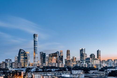 Free Stunning view of Beijing's modern skyline at dusk featuring iconic skyscrapers and a vibrant urban landscape. Stock Photo