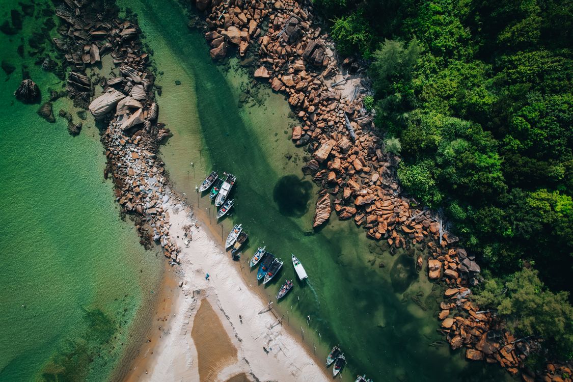 Aerial View of Boats and Rocky Coastline in Malaysia · Free Stock Photo
