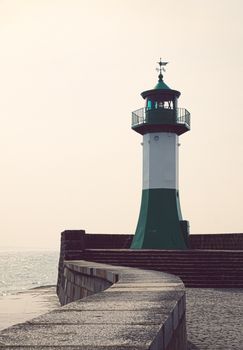Sassnitz lighthouse overlooking the Baltic Sea during dusk, offering a tranquil seascape view.