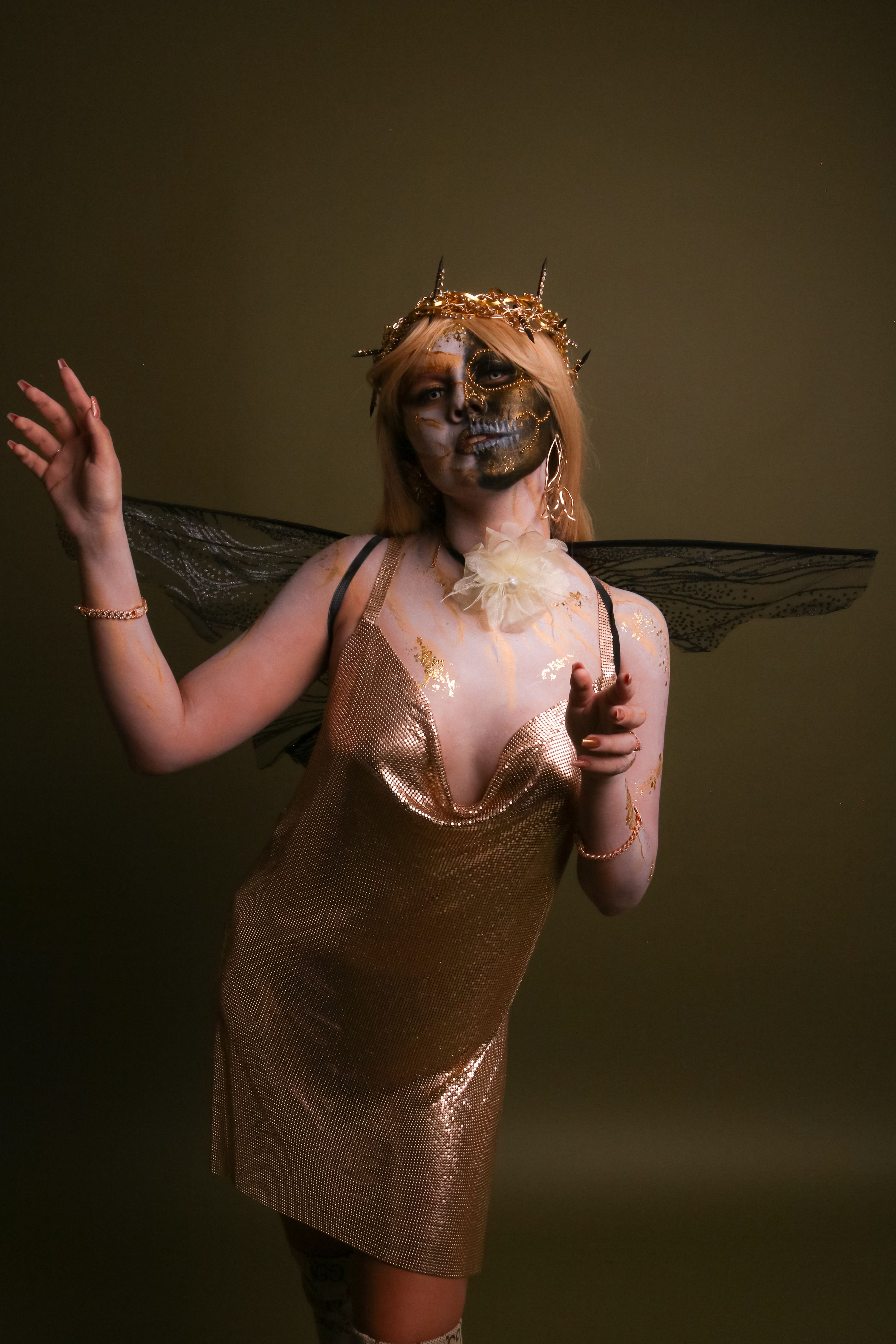 Enchanting Gold Skeleton Costume with Wings  Free Stock Photo