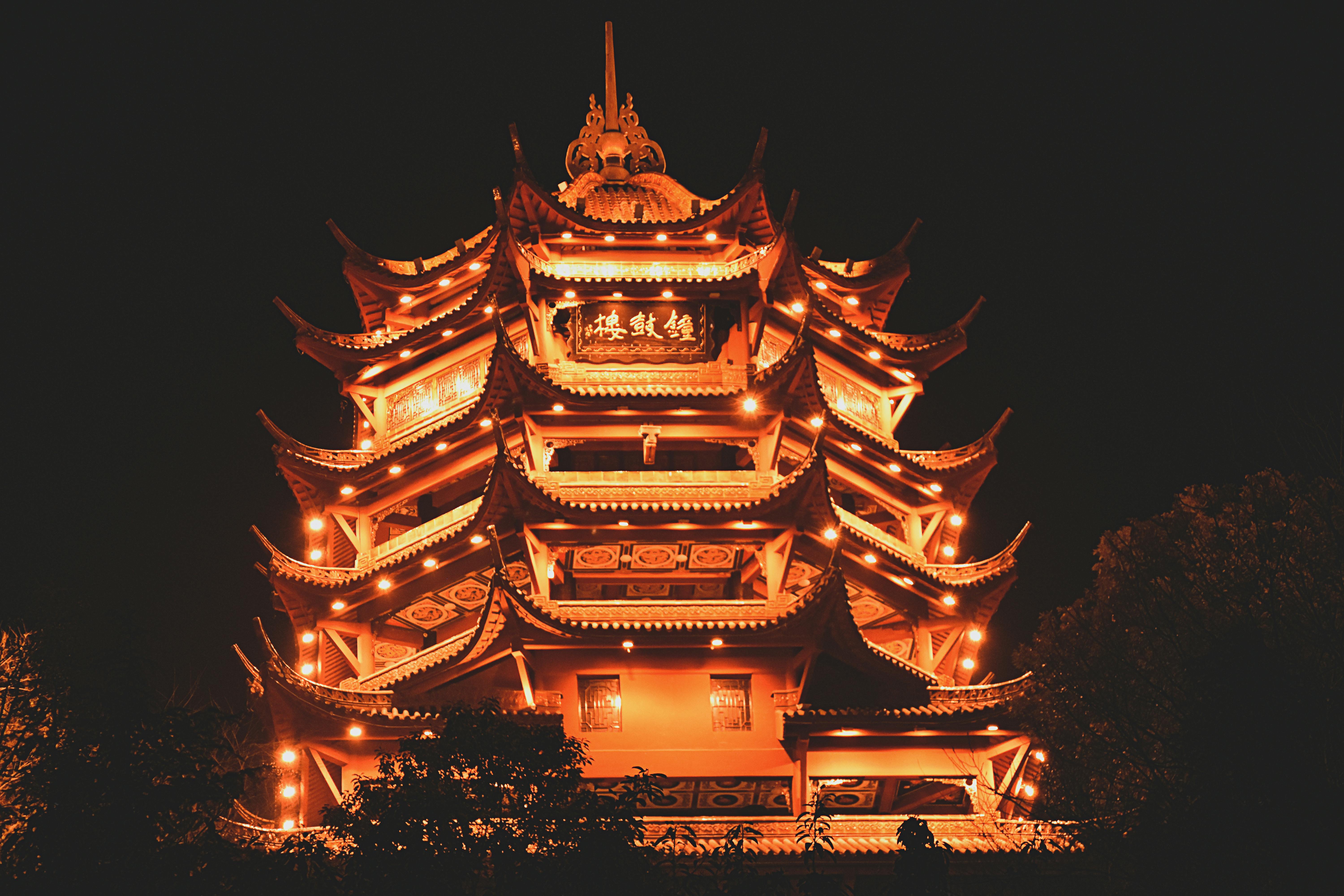 lighted pagoda at night