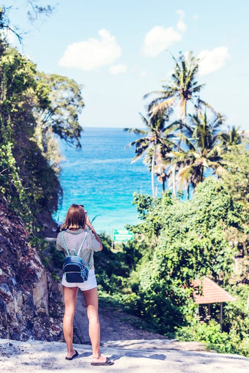 Free Woman Taking Photo of the Beach Stock Photo