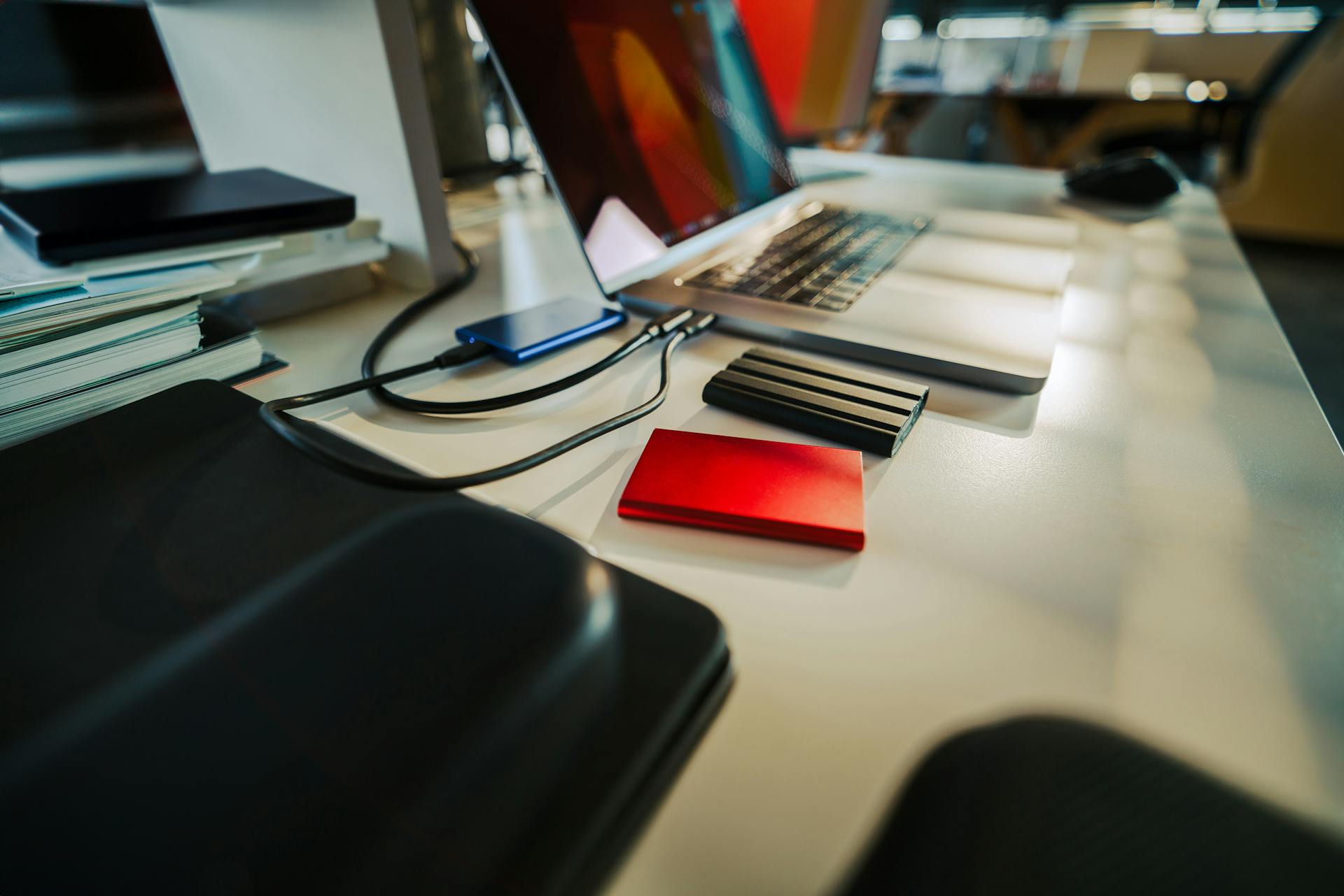 Modern Office Desk with Laptop and External Drives