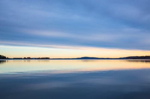 Free Large Body of Water during Dawn Stock Photo