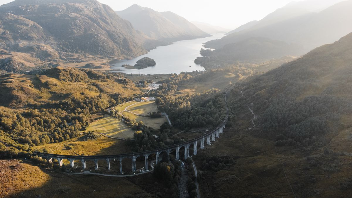 Aerial view of the Glenfinnan viaduct and the loch below
