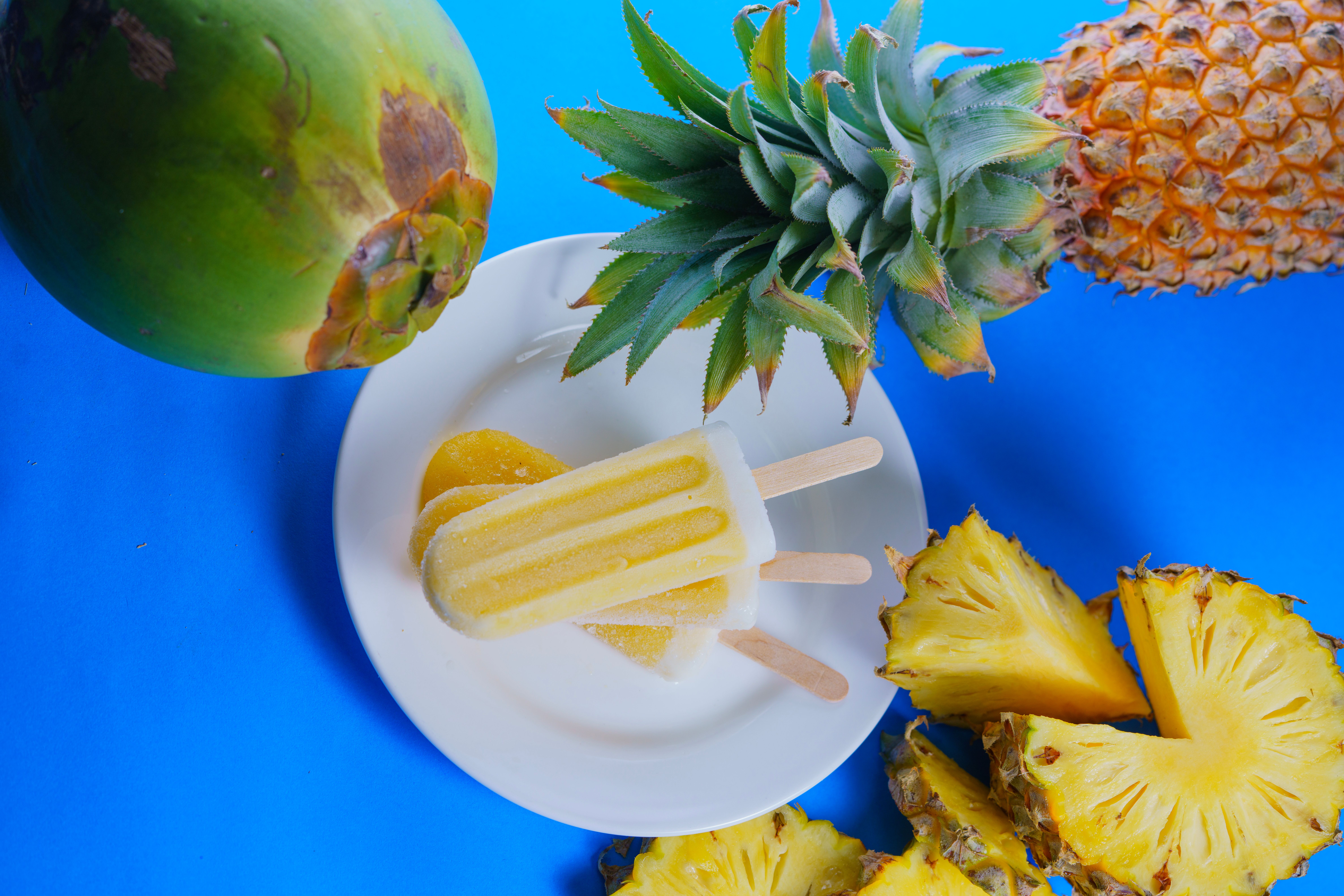 Slices of Coconut Cream Icebox Pie with grilled pineapple on top