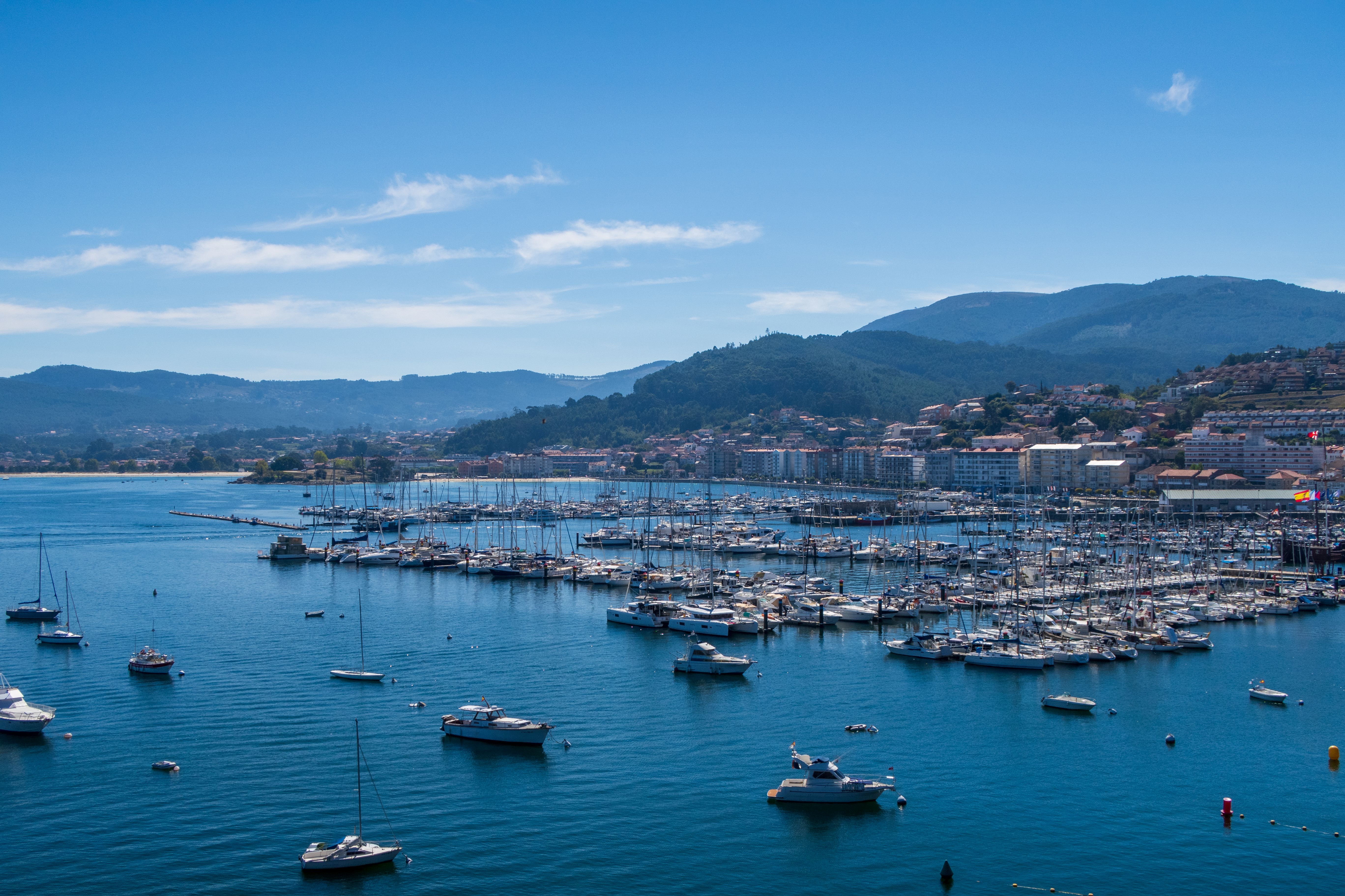 Scenic Marina View with Boats and Blue Sea · Free Stock Photo