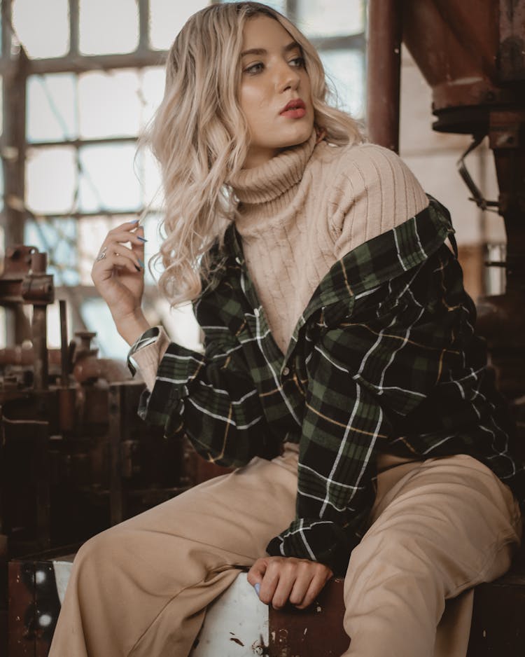 Photo Of Woman Sitting Alone Posing While Looking Away