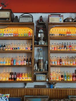 A nostalgic display of colorful vintage soda bottles in a cafe in İzmir, Turkey.