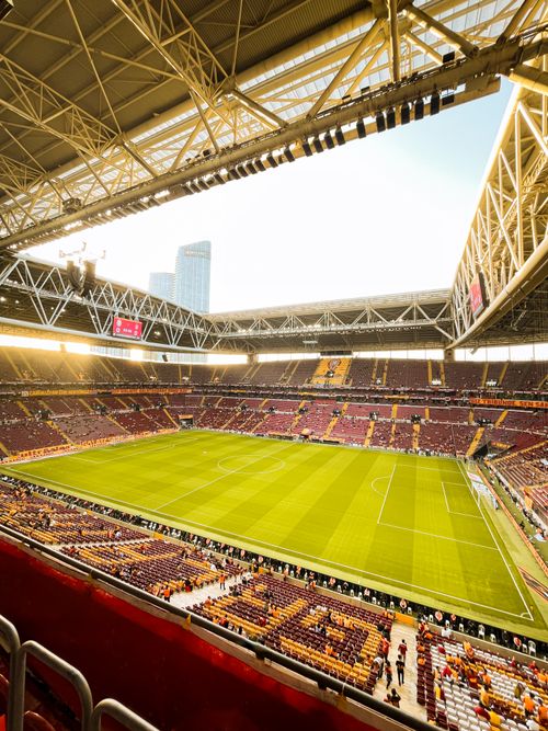 Free Sunlit football stadium in Istanbul, capturing the vibrant game atmosphere. Stock Photo