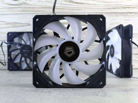 Close-up of modern black and white computer cooling fans with sleek design.