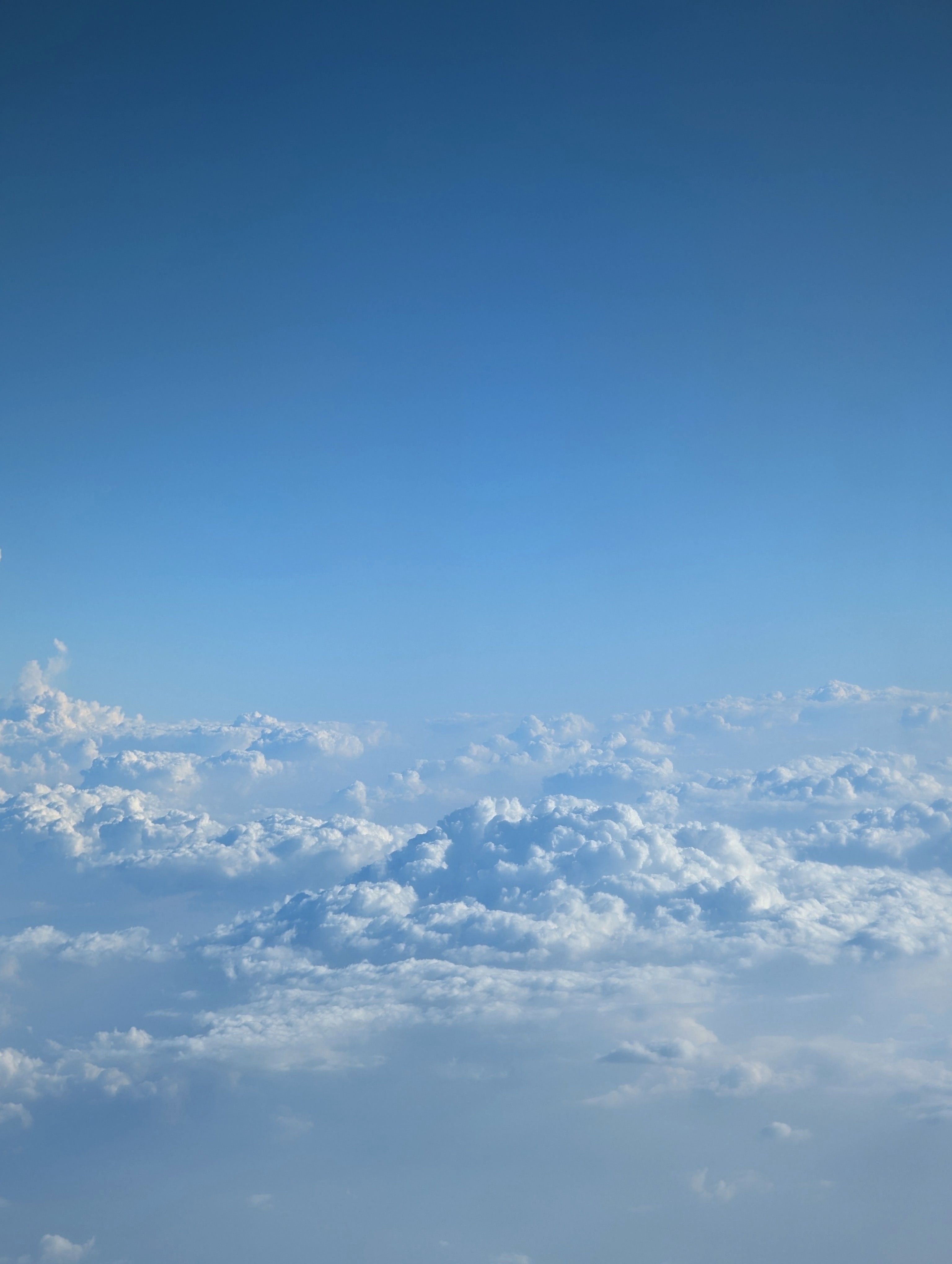 Serene Blue Sky with Fluffy White Clouds · Free Stock Photo