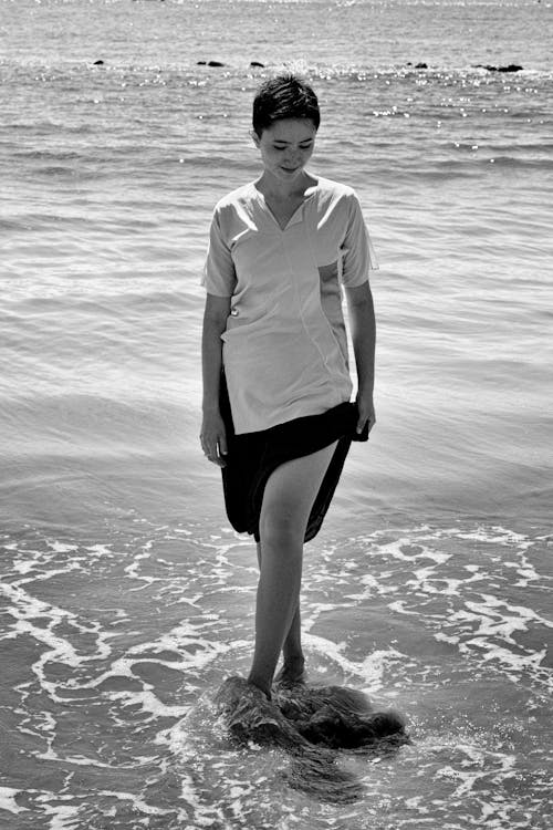 Monochrome Photo Of Woman Standing On Beach