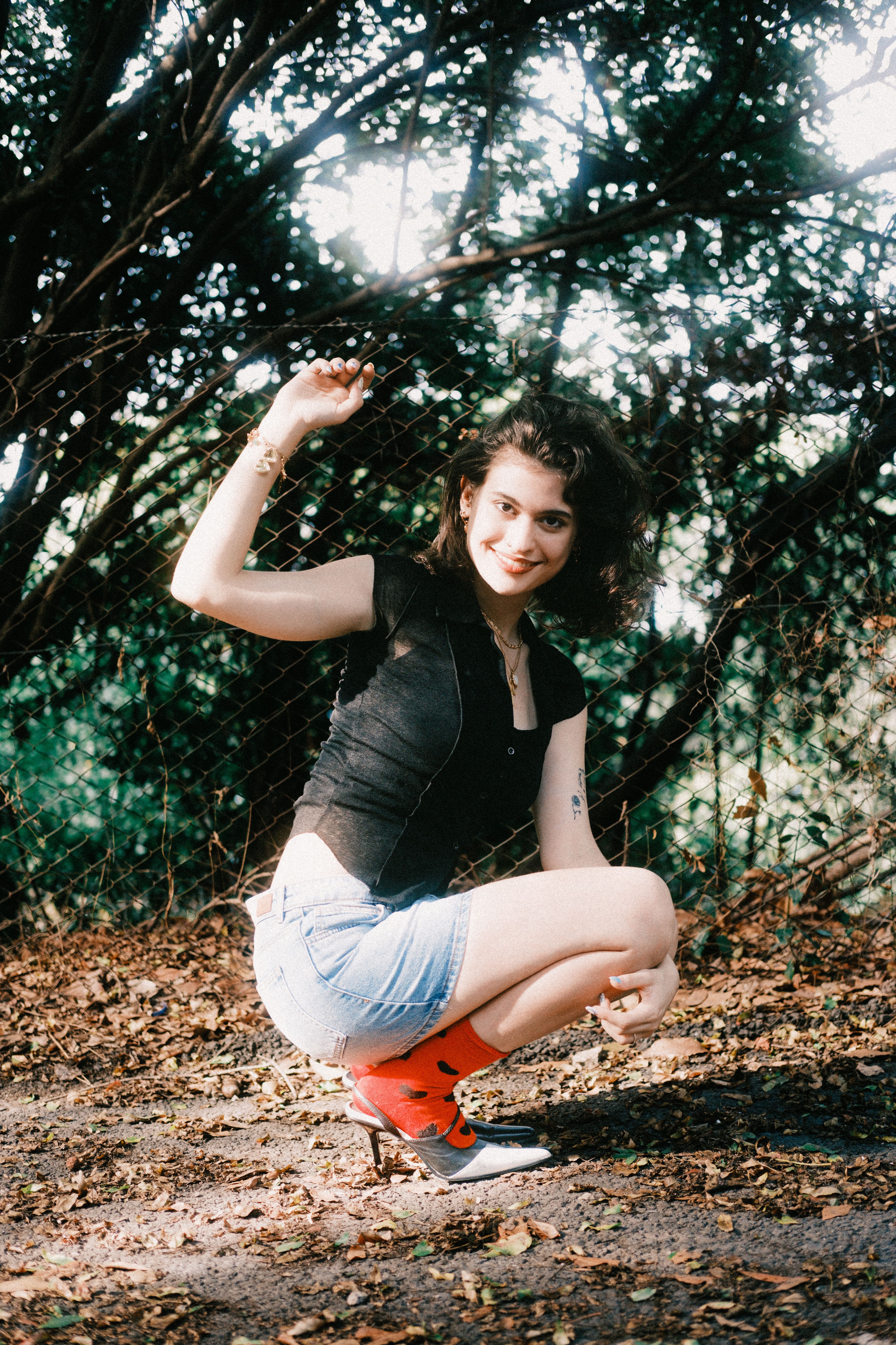 Young Woman Posing Outdoors in Casual Attire · Free Stock Photo