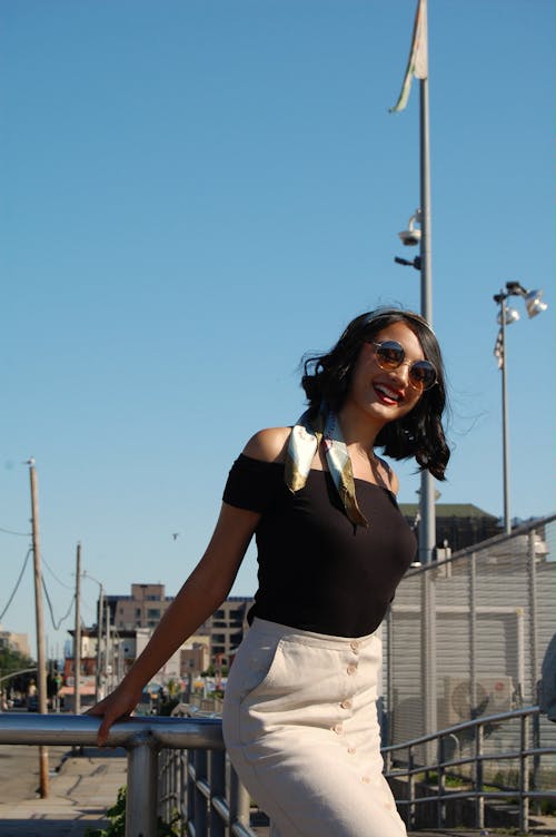 Photo Of Woman Holding The Handrail 