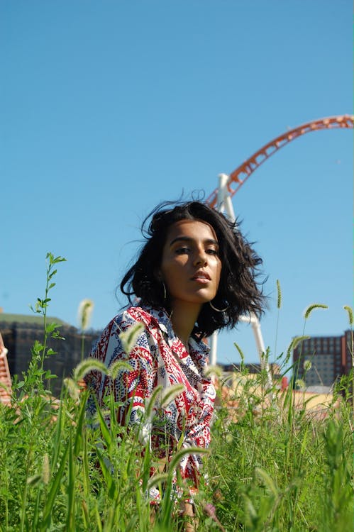 Photo Of Woman Sitting On Field