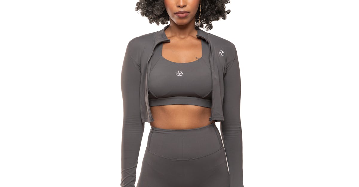 Two colleagues having a focused discussion around a whiteboard in an innovation lab