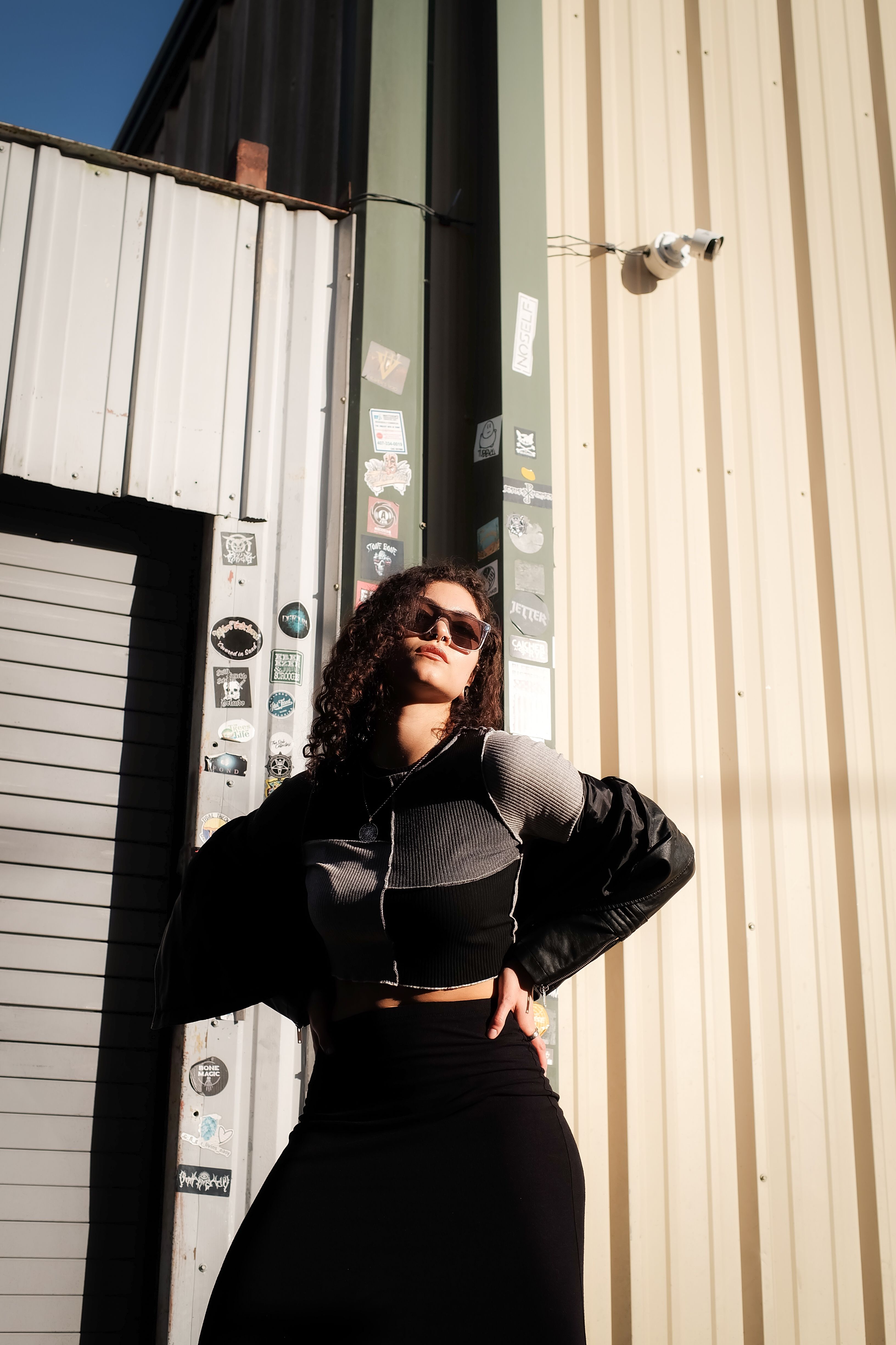 Confident Woman Posing in Urban Setting · Free Stock Photo